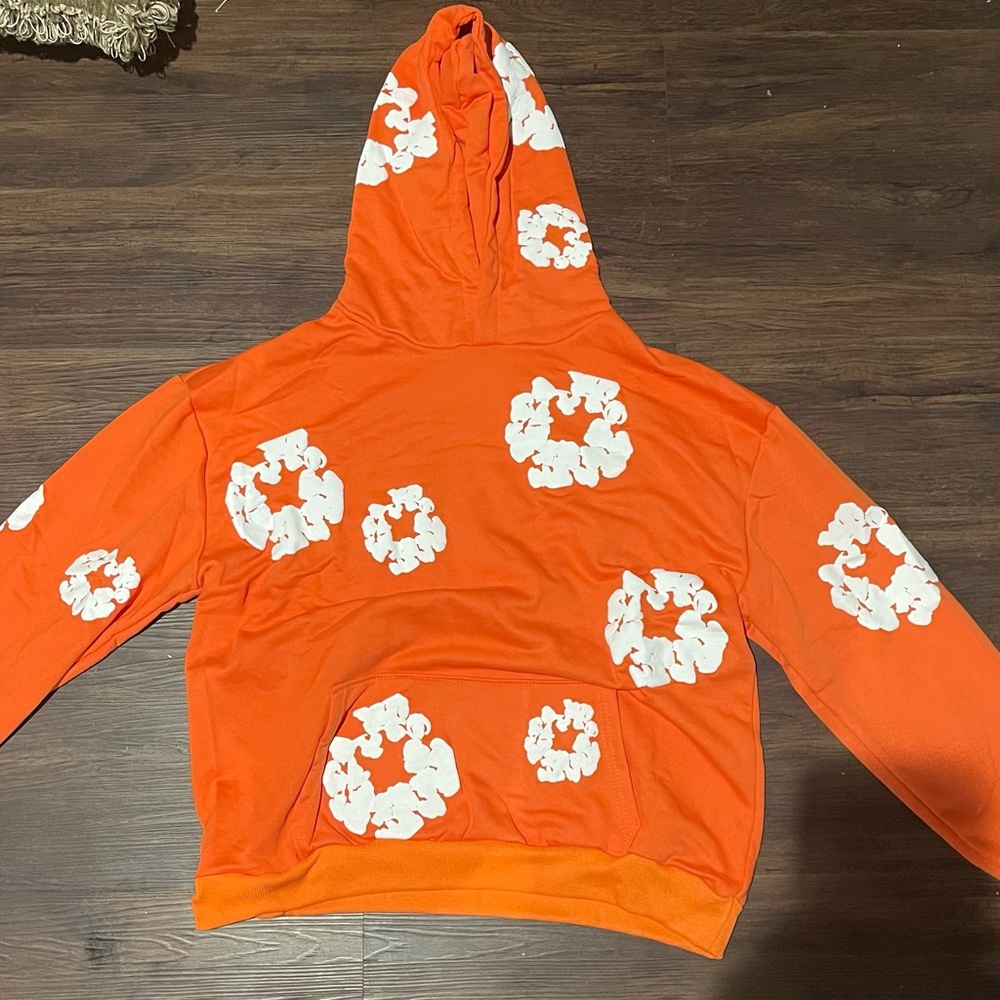 Orange Hoodie with White Floral Patterns